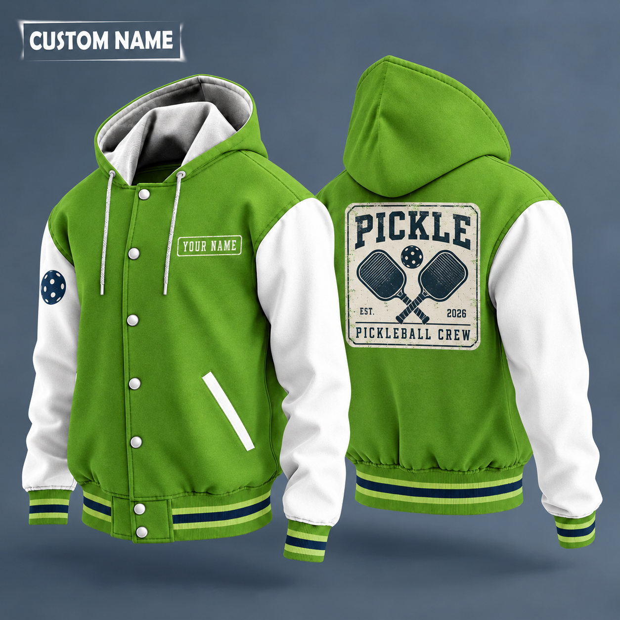 Hooded letterman jacket with white sleeves, crossed pickleball paddles on the back, "PICKLE" lettering and a custom name on a work-shirt style name tag print on the chest