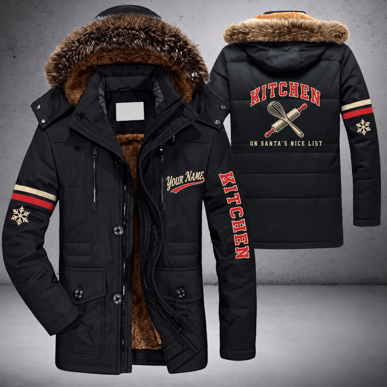 Black parka jacket with a faux-fur hood, snowflake and whisk and rolling pin on the back, "KITCHEN" lettering and a custom name in script on the chest