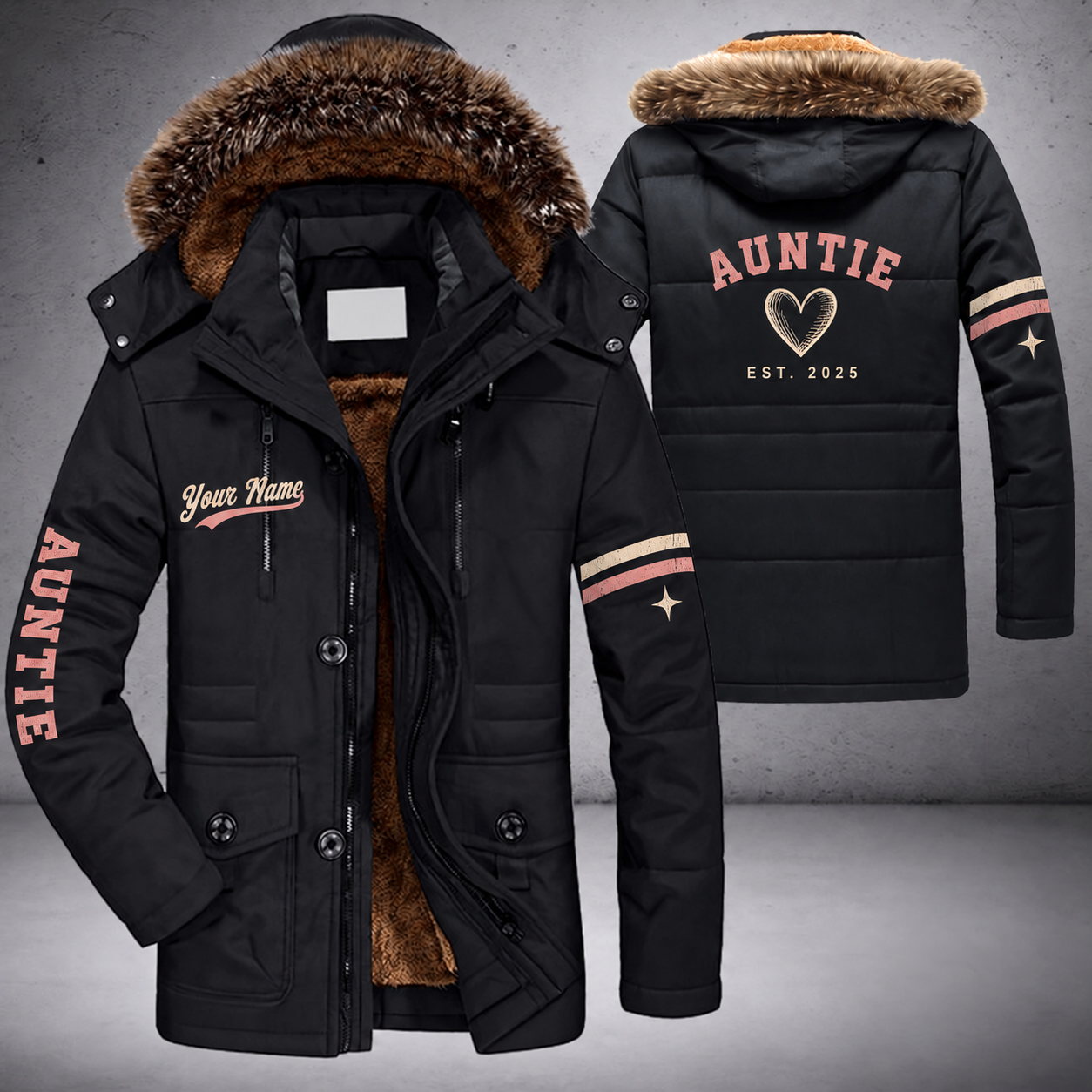 Black parka jacket with a faux-fur hood, heart on the back, "AUNTIE" lettering and a custom name in script on the chest