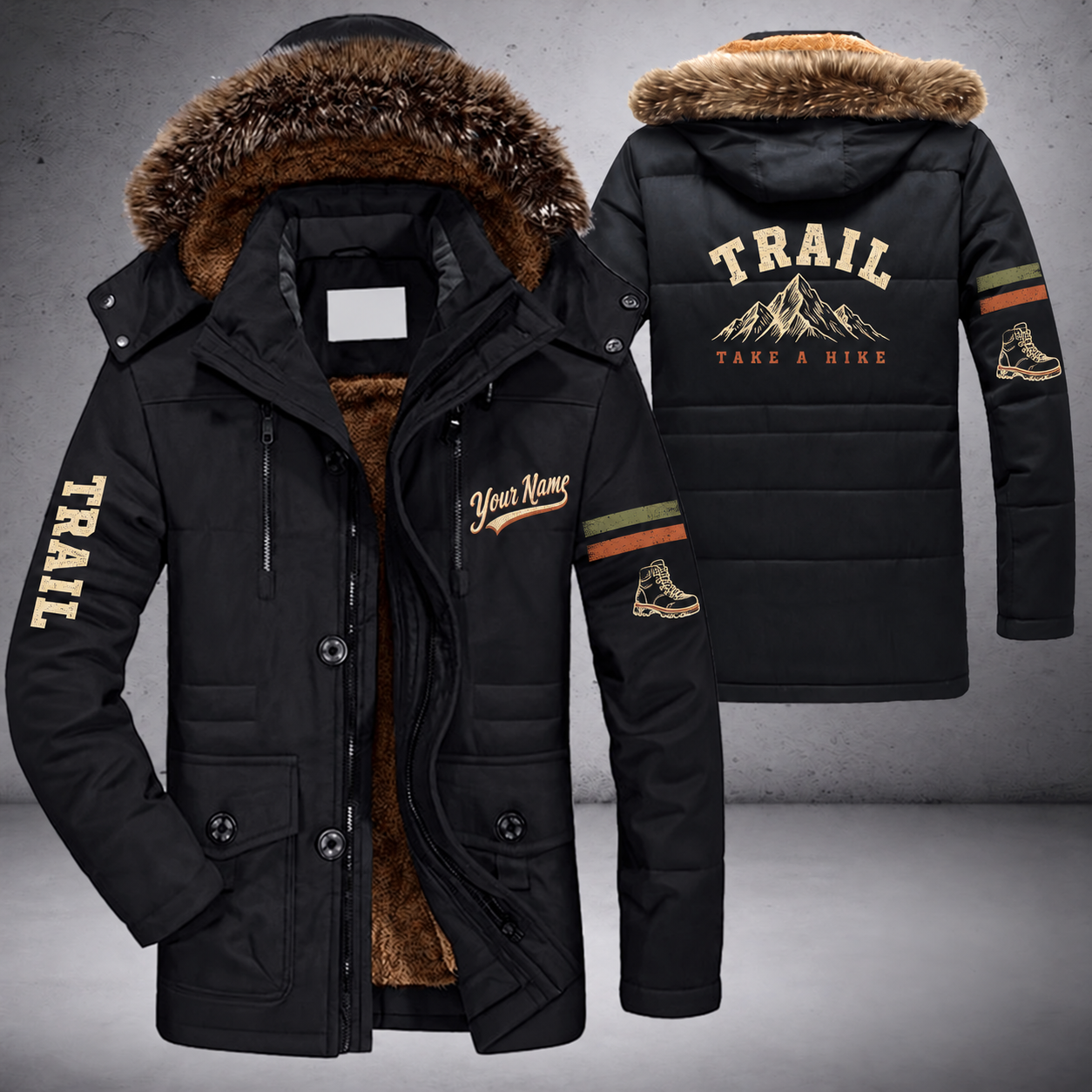 Black parka jacket with a faux-fur hood, mountain peak on the back, "TRAIL" lettering and a custom name in script on the chest