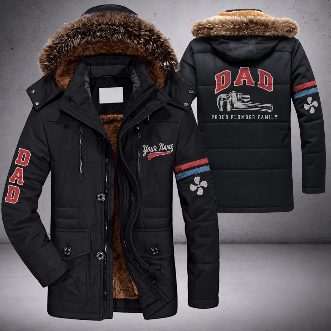 Black parka jacket with a faux-fur hood, pipe wrench on the back, "DAD" lettering and a custom name in script on the chest