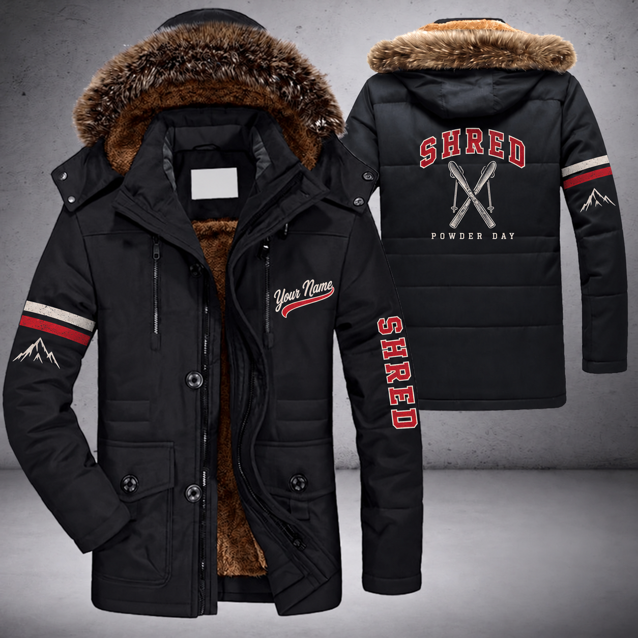 Black parka jacket with a faux-fur hood, crossed skis on the back, "SHRED" lettering and a custom name in script on the chest