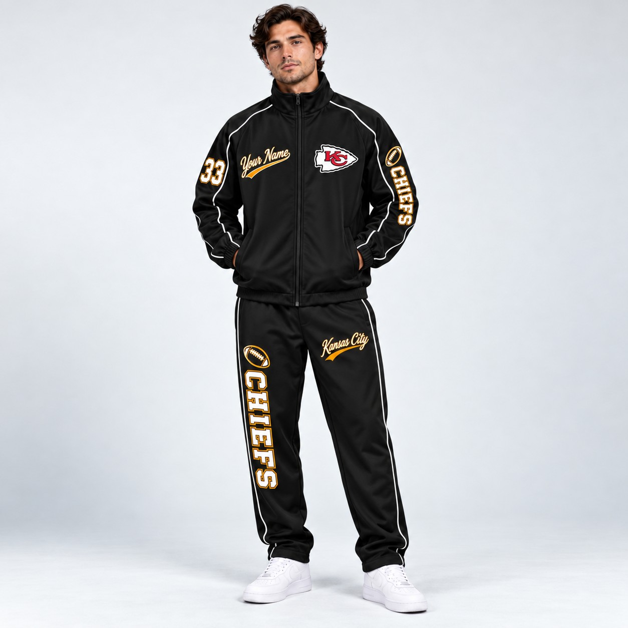 Model wearing the Kansas City Chiefs tracksuit set in black