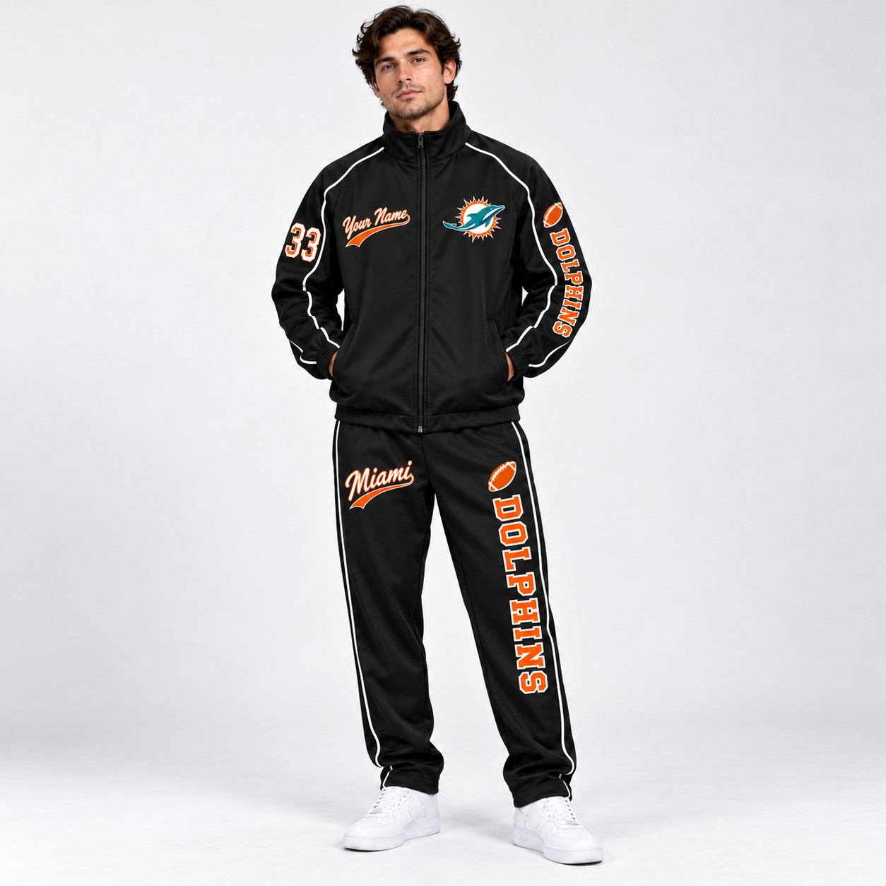 Model wearing the Miami Dolphins tracksuit set in black