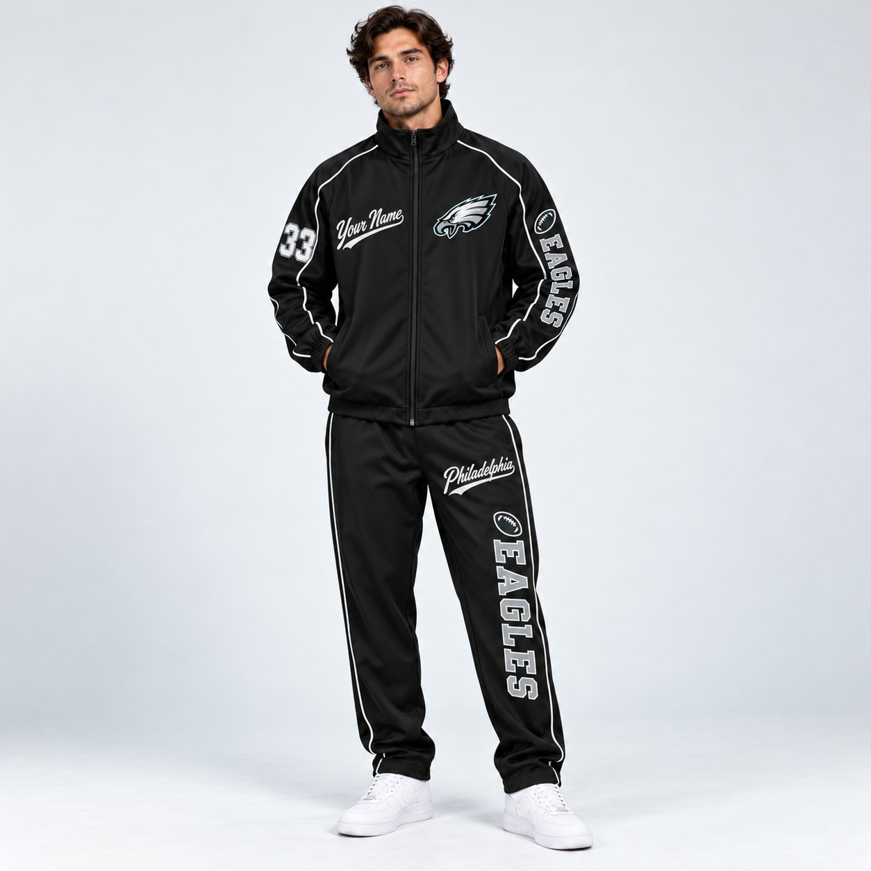 Model wearing the Philadelphia Eagles tracksuit set in black