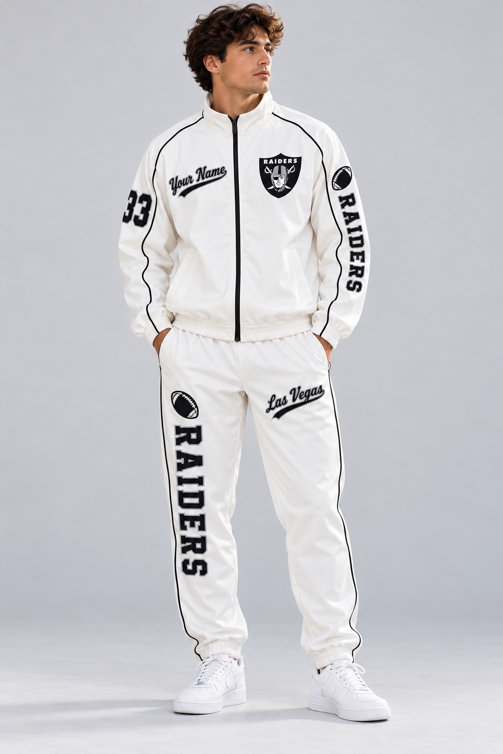 Model wearing the Las Vegas Raiders tracksuit set in white