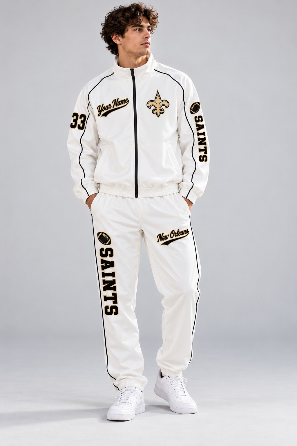 Model wearing the New Orleans Saints tracksuit set in white